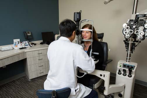 Optometrist performing eye exam