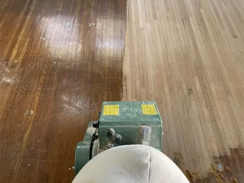 hardwood floor refinishing in progress