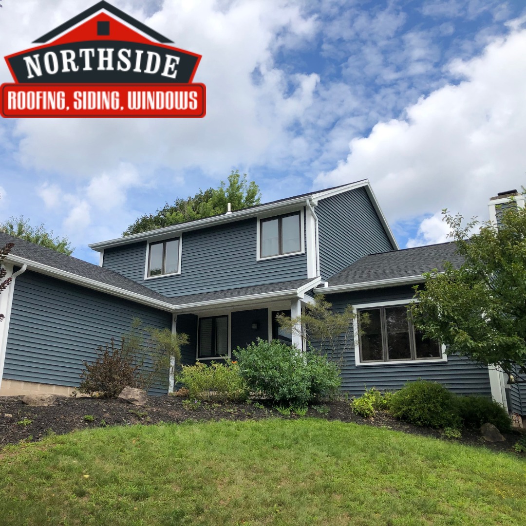 teal two story house with white trim