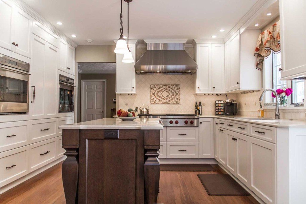 white kitchen cabinets with wood island