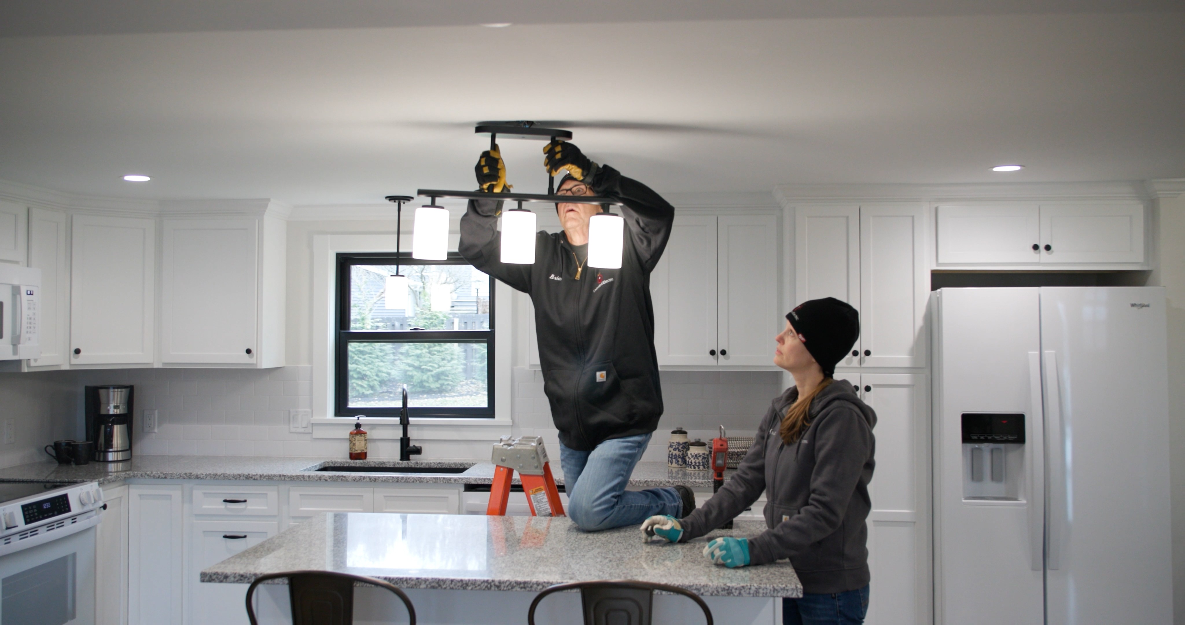 Unlimited Electric technician performing an electrical upgrade