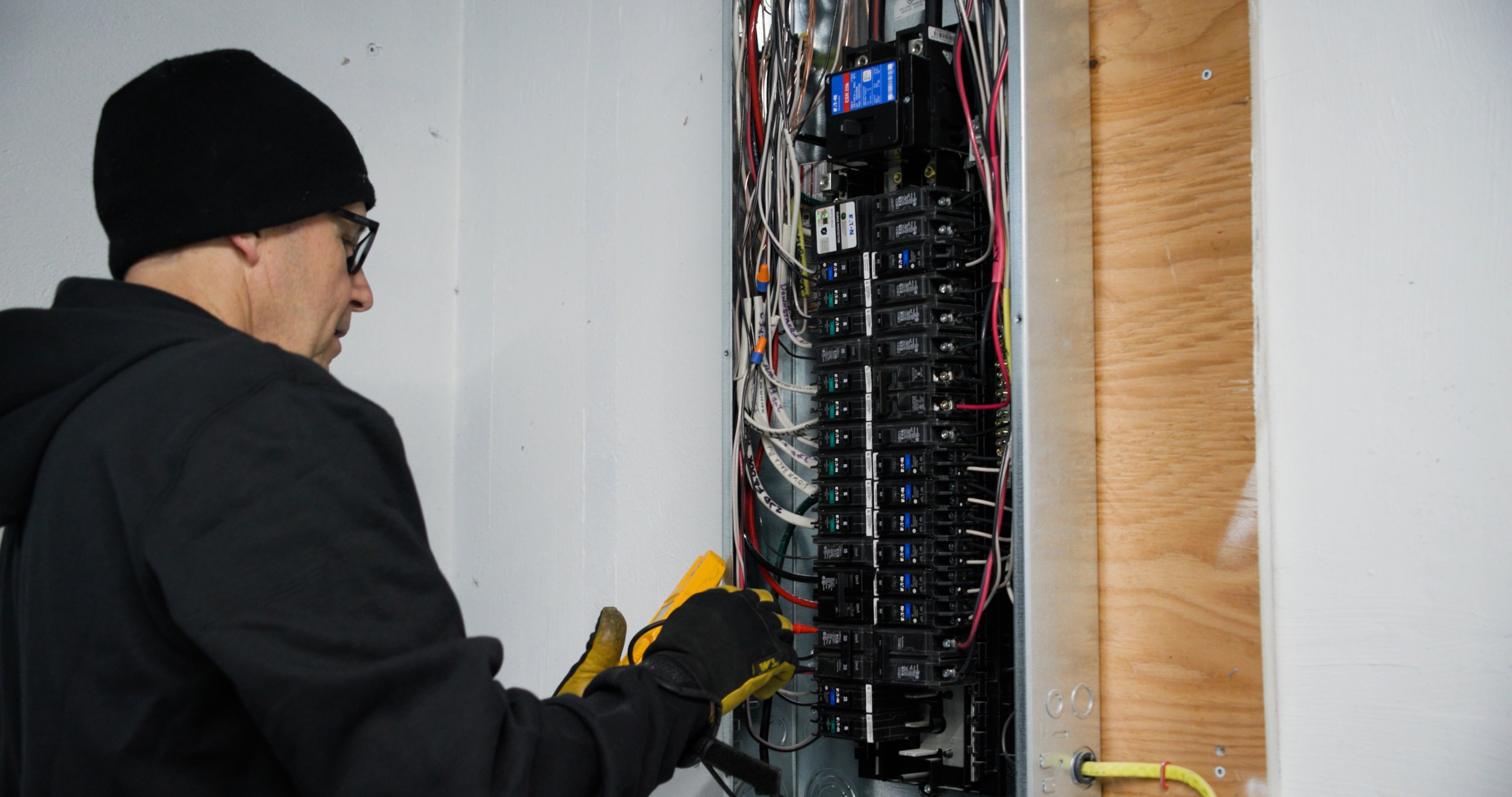 Unlimited Electric technician performing an upgrade