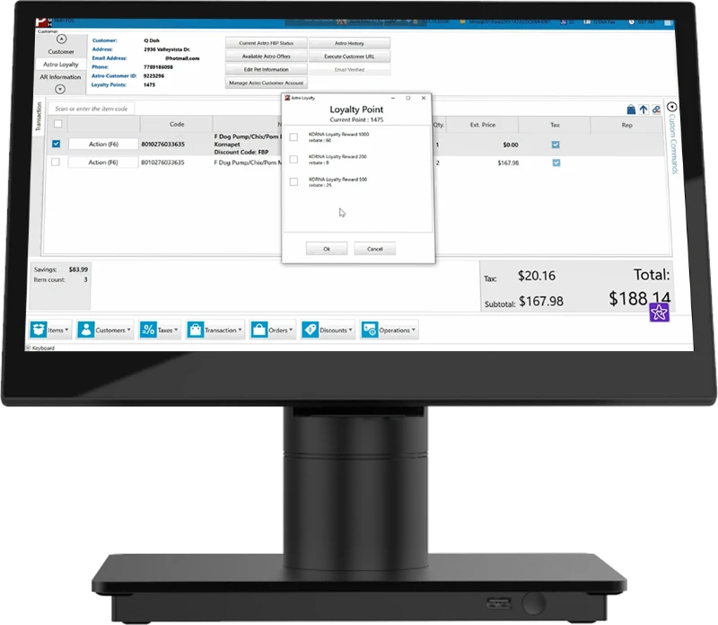A computer monitor displays a point-of-sale system with an open loyalty points popup window.
