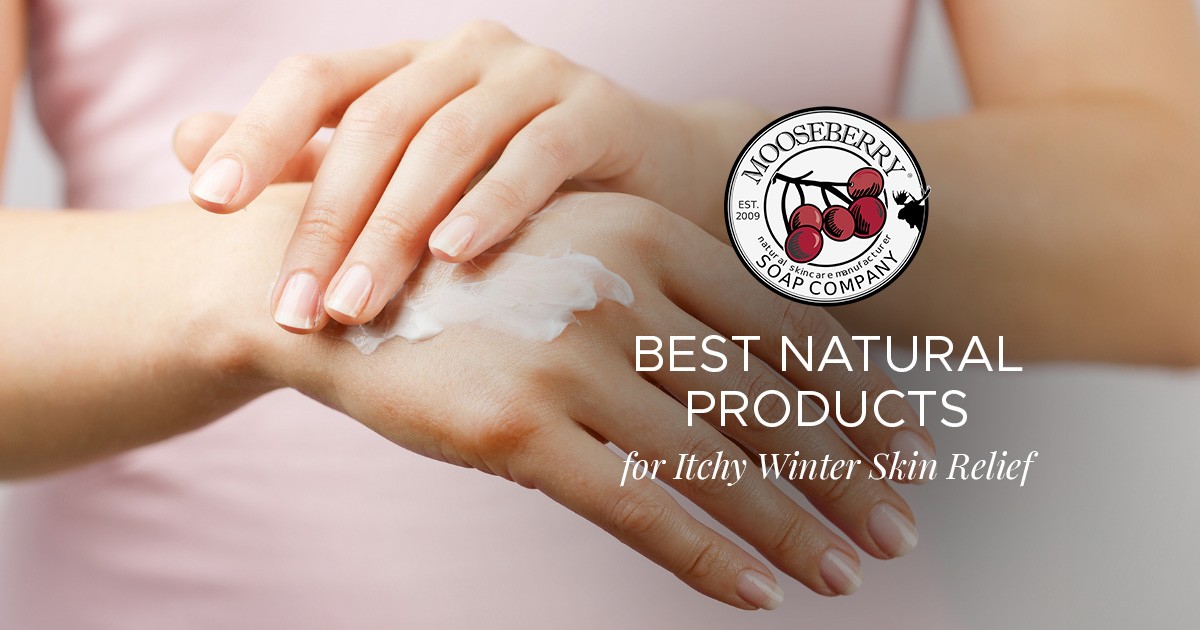 Hands applying lotion with Mooseberry Soap Company logo and text about winter skin relief products.