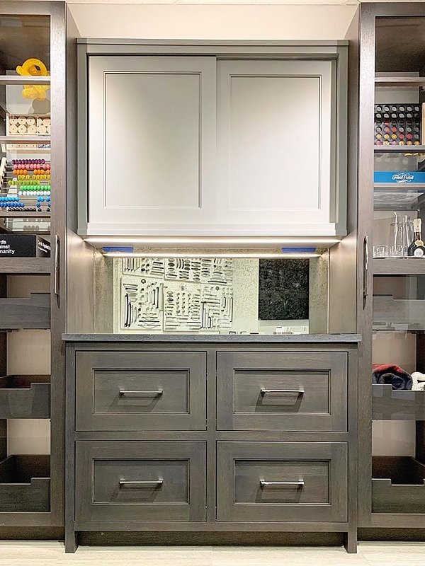 grey cabinets in custom media center with drawers and shelving