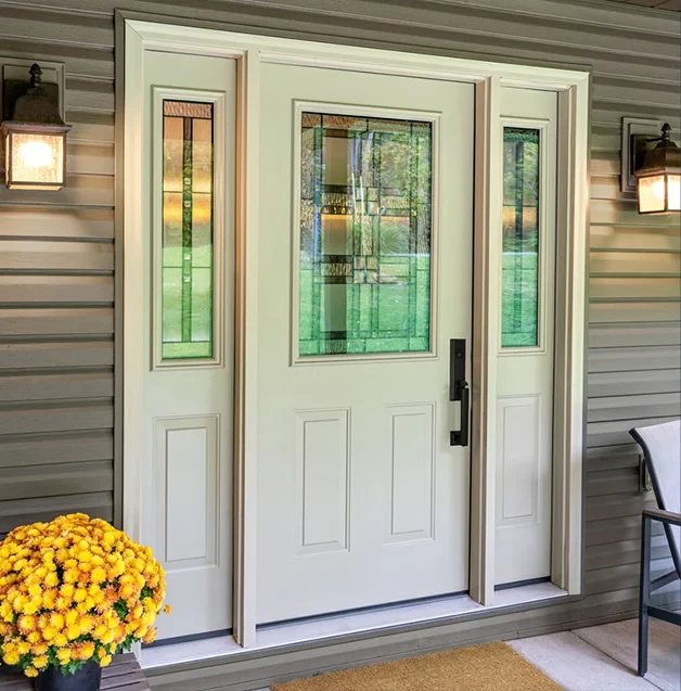 White front door with glass panels, yellow flowers, and a chair on a porch with wall lanterns.