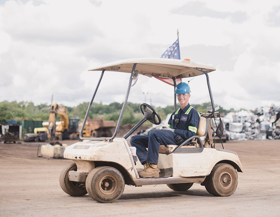 metalico employee in golf cart