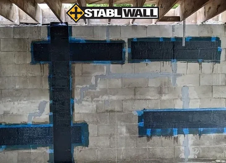 StablWall logo and a cement basement wall with StablWall product it.