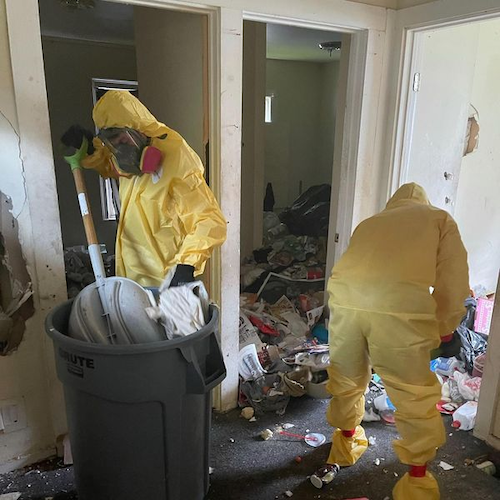 hqr employees cleaning in hazmat suits