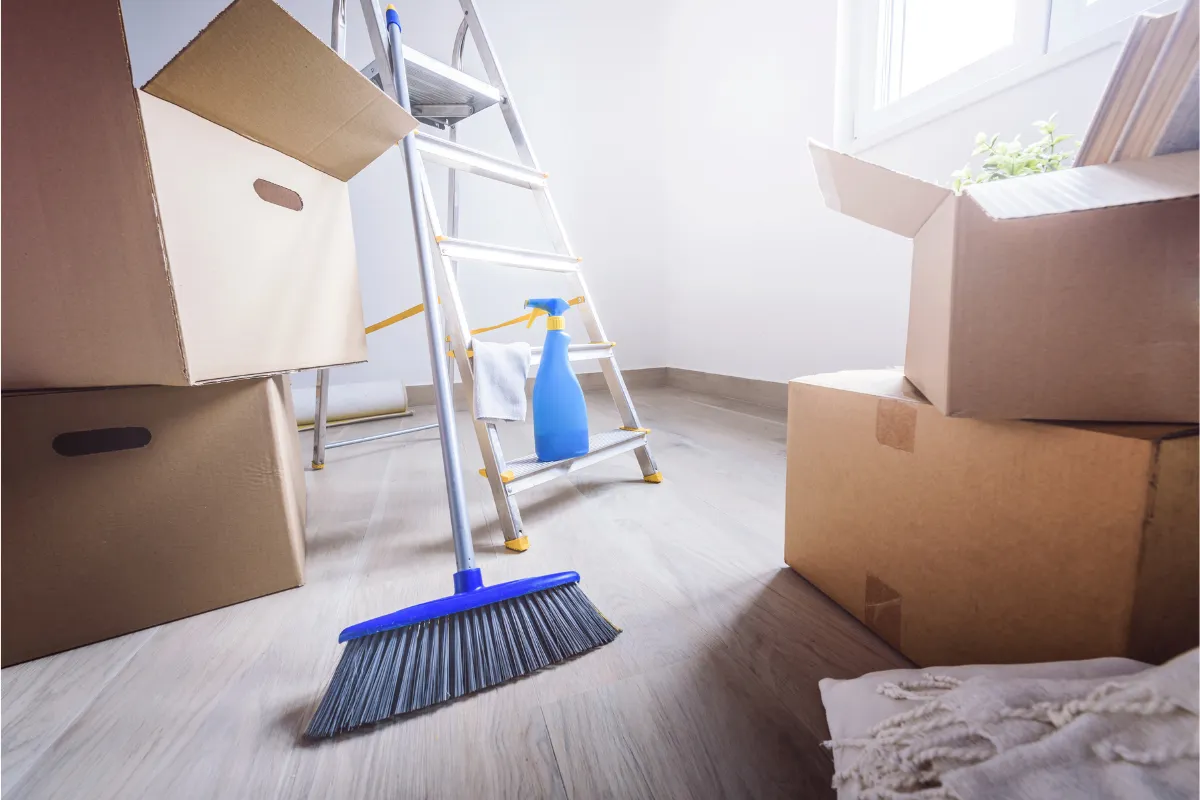 ladder and boxes with cleaning supplies in move in home