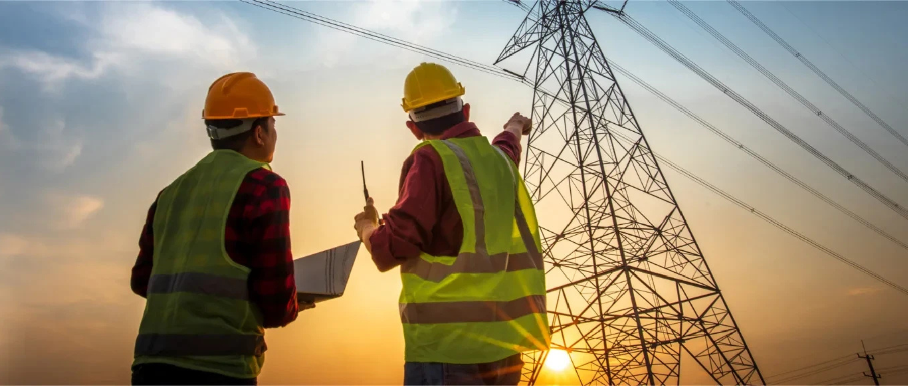 Four hanging pendant lights with perforated metal shades, each glowing with a visible bulb.