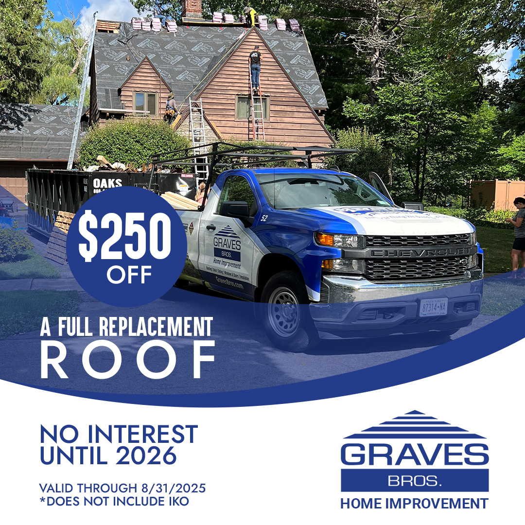 truck advertises 500 off roof replacement; workers install shingles on a house behind it
