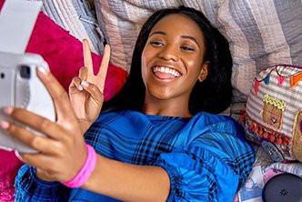 teen with perfect smile taking a selfie