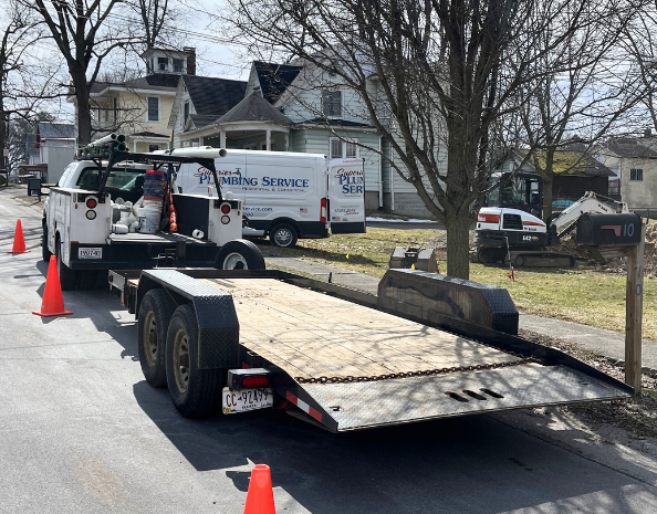 Two blue submersible sump pumps with labels, one has a white float switch attached.