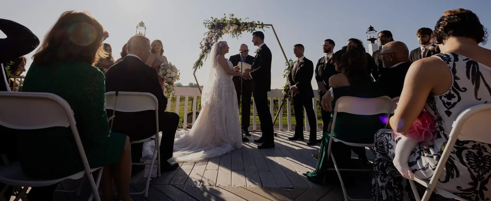 officiant with bride and groom
