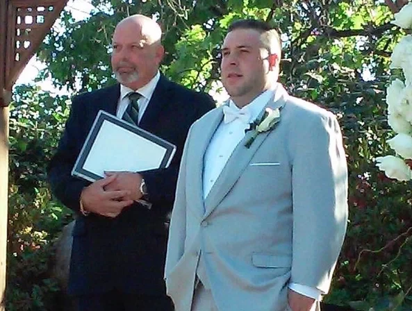 officiant standing with groom