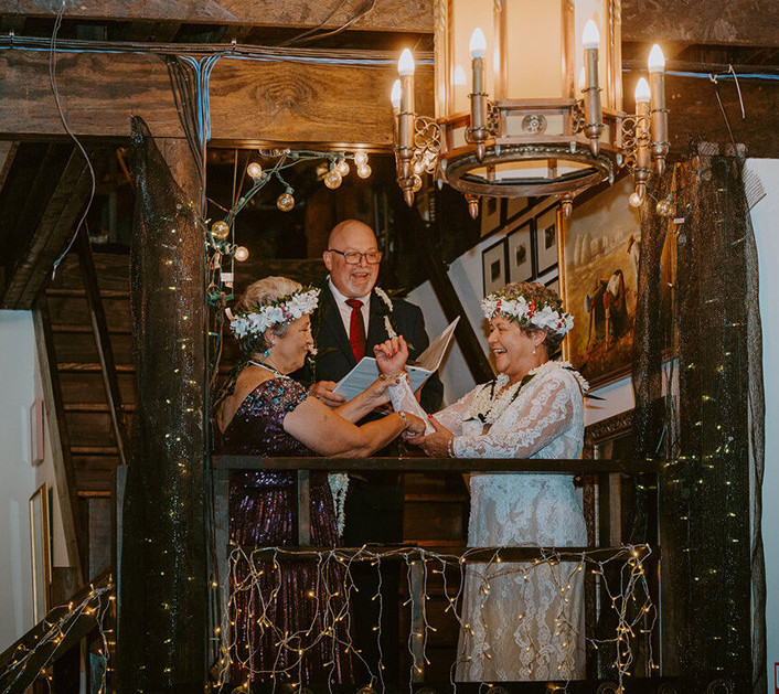 wedding ceremony brides and officiant