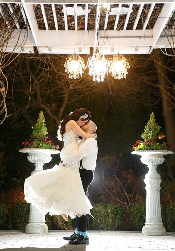 bride and groom kissing with backlighting