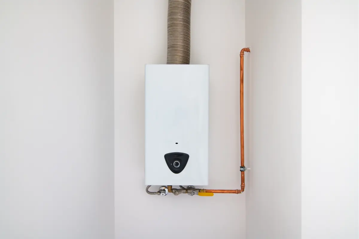 white tankless water heater installed in a white wall
