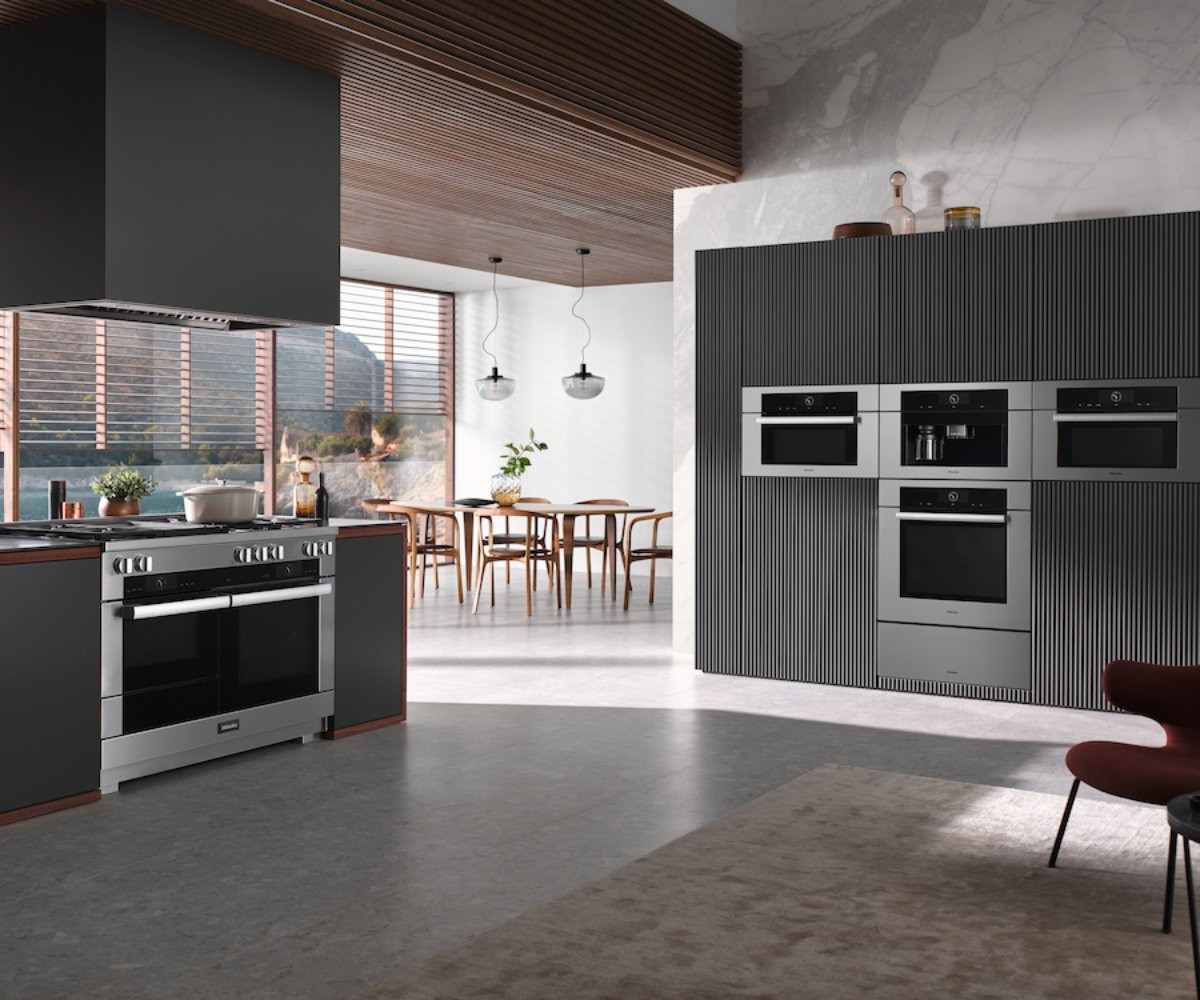 modern kitchen black cabinets silver appliances