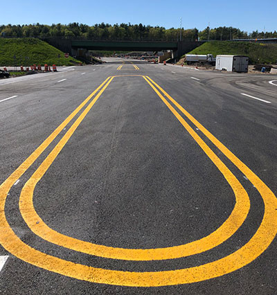 rounded yellow double line on road