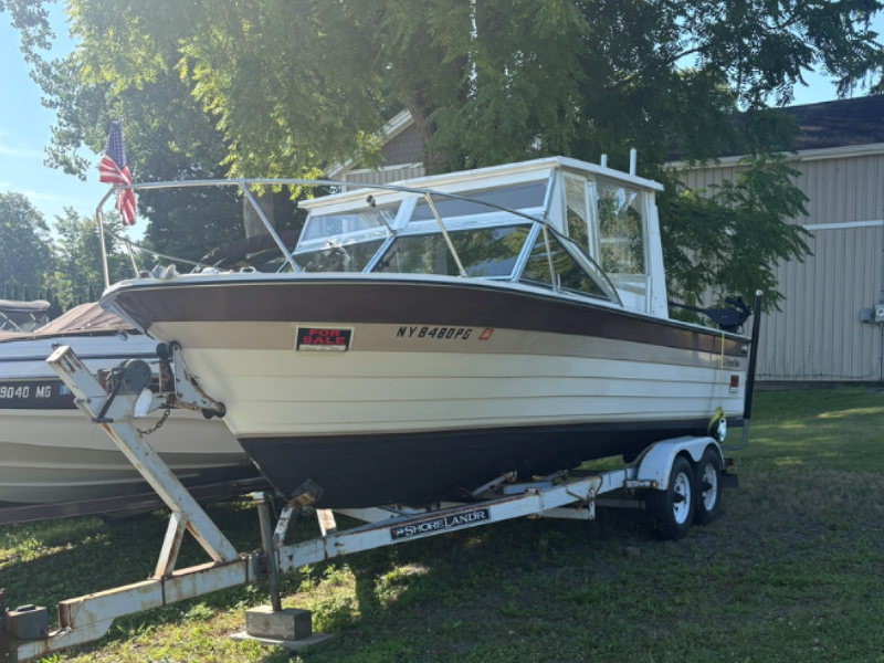 1984 Penn Yan 23-foot cuddy cabin boat on a tandem Shorelander trailer