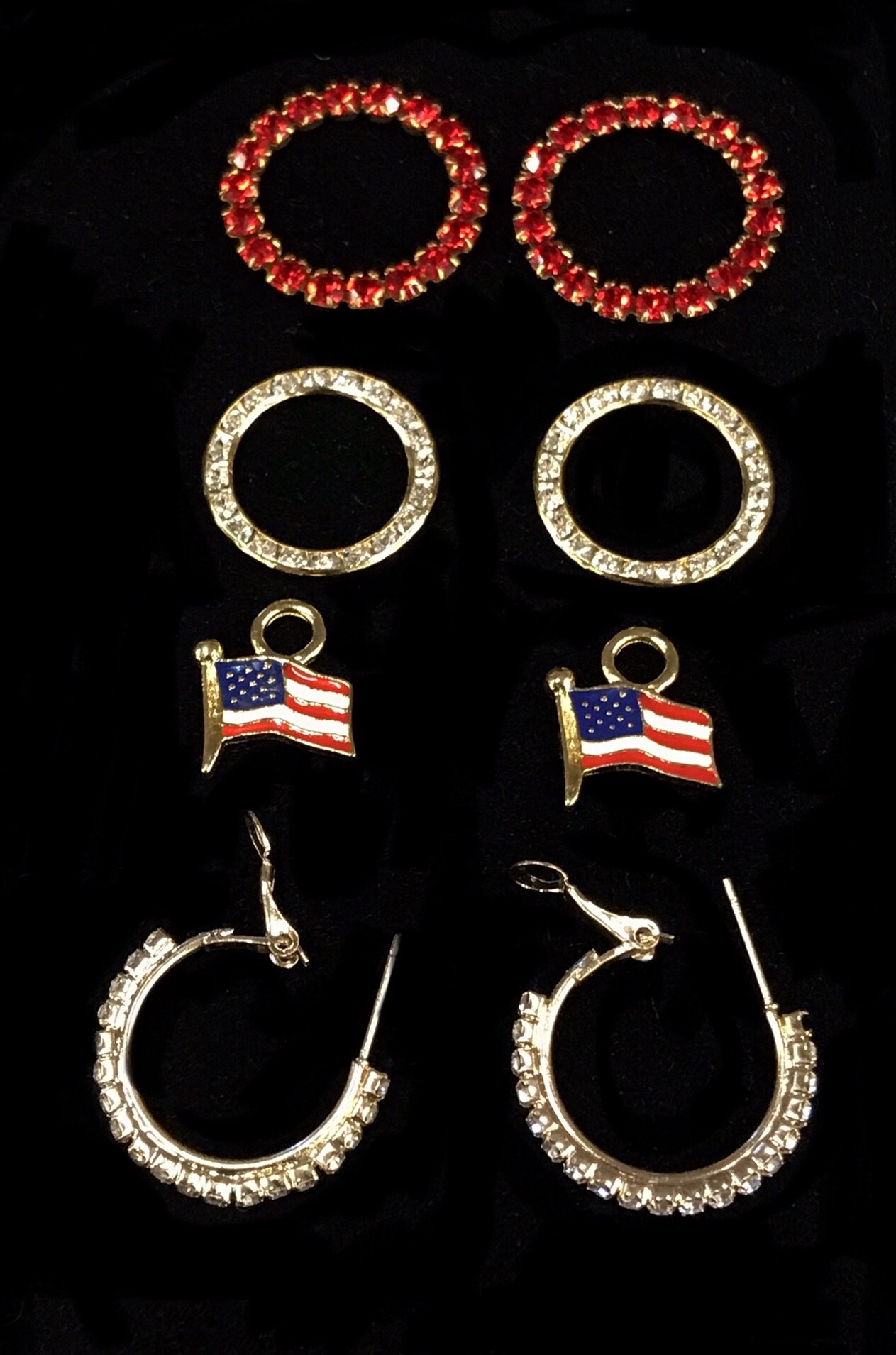 Flag set with crystal hoops and large crystal rings $76