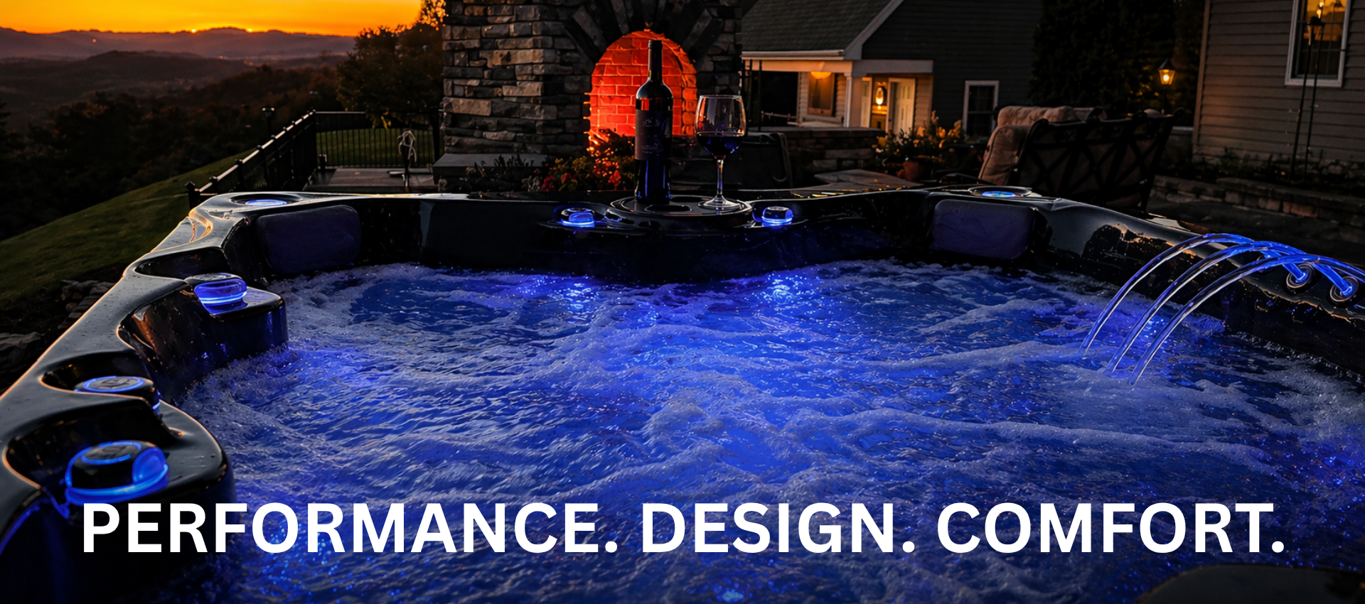 hot tub at night with lights on and outdoor fireplace