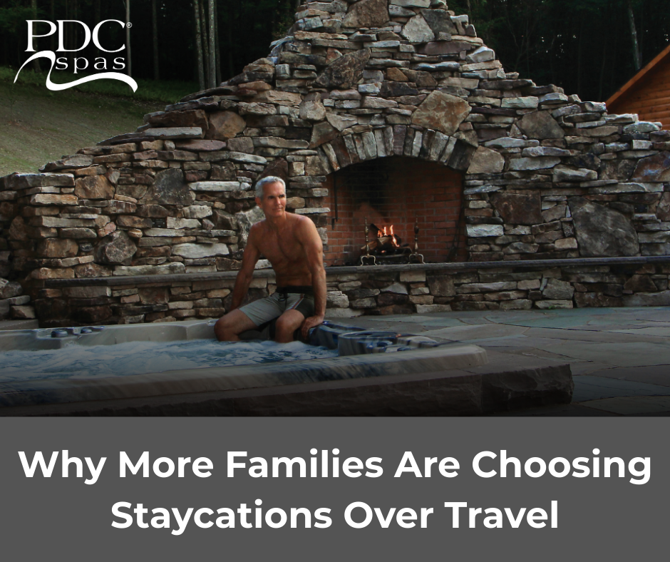 man relaxing in backyard hot tub staycation