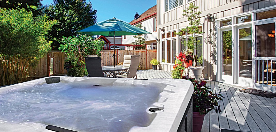 pdc spas hot tub in silver marble shell installed on a deck