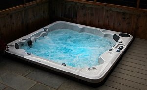 hot tub with water bubbling and blue hot tub lights