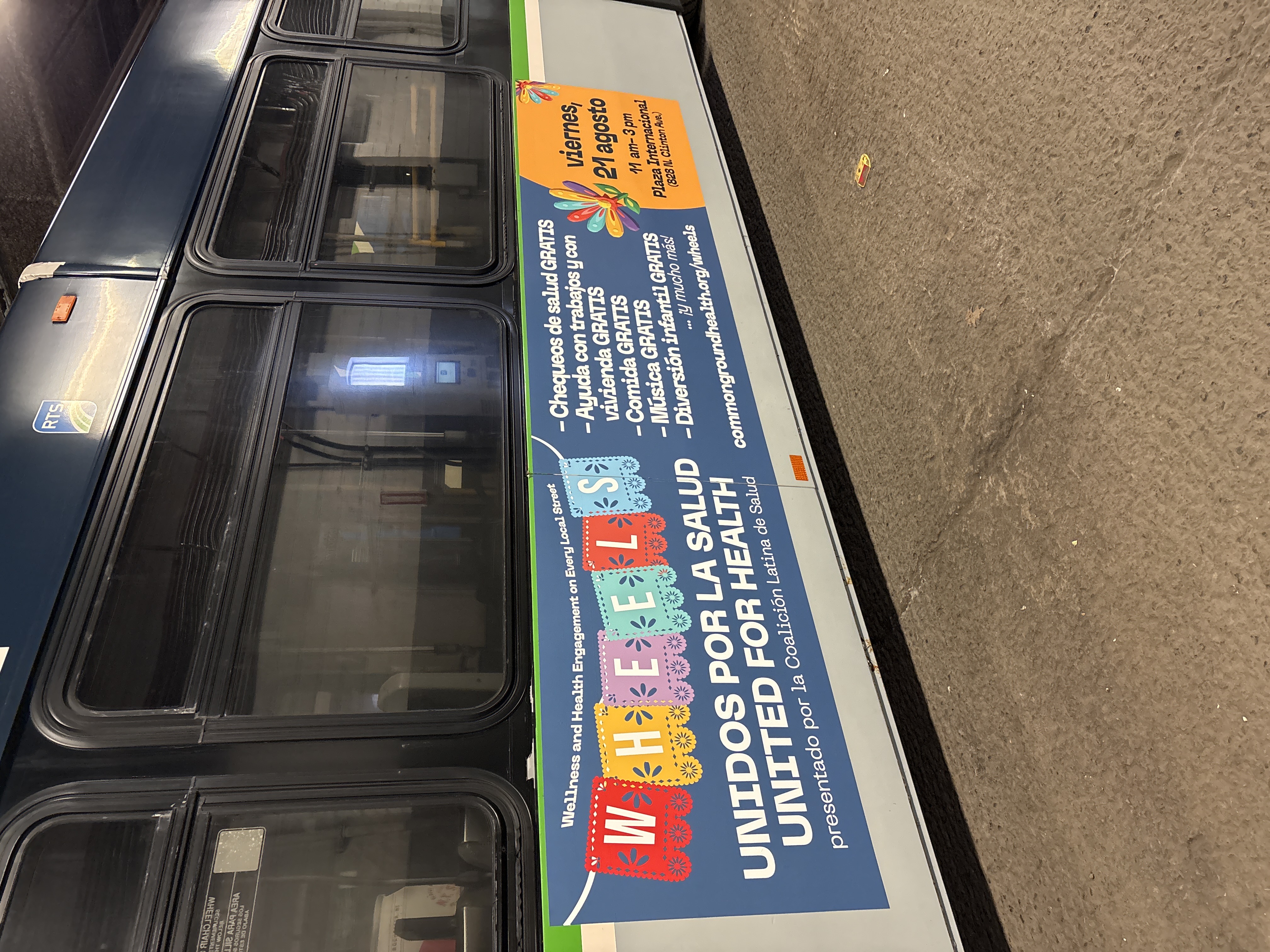 RTS bus with colorful ad on the side for the WHEELS event