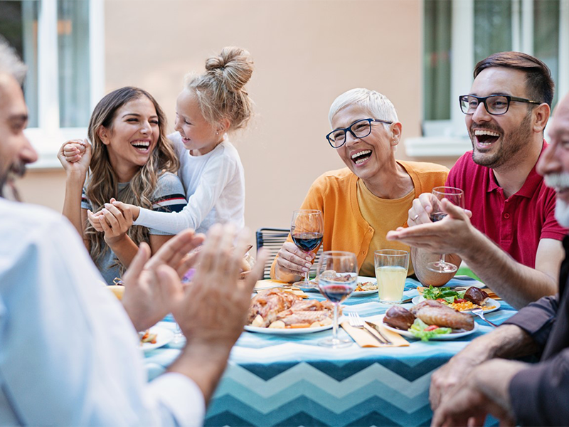 happy family enjoying a meal together and laughing