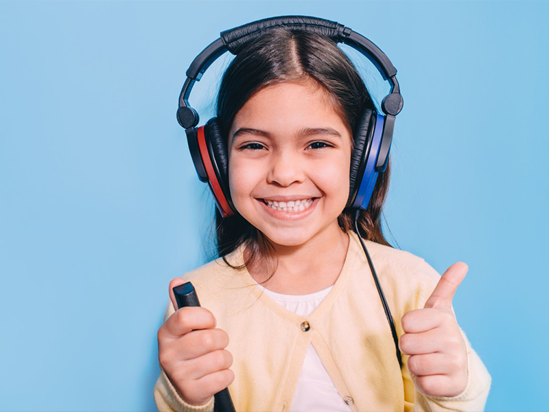 girl with hearing test headphones