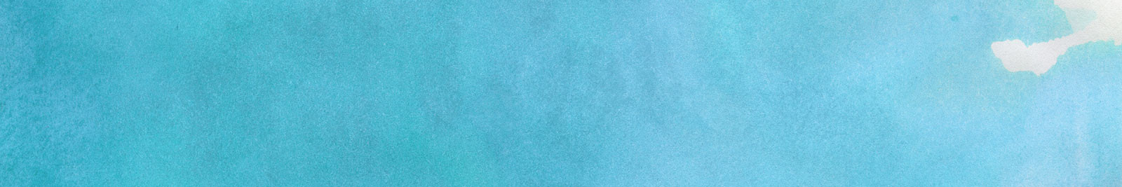 A person getting a facial treatment with a towel placed on their face by a spa worker.