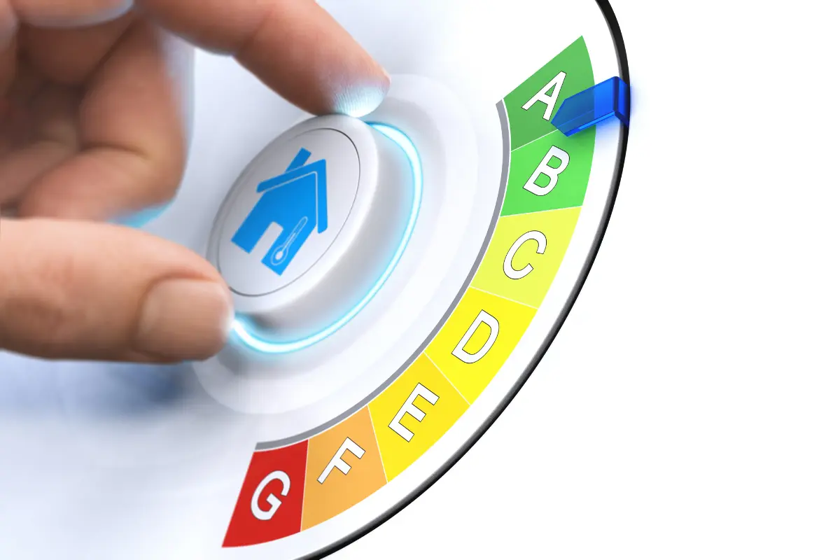 hand on a dial with a home icon changing home energy rating from A to G