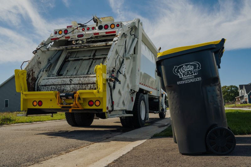 Garbage and recycling bins at the curb for weekly pickup.