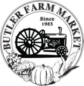A vintage tractor with produce, encircled by “Butler Farm Market Inc. Since 1985.