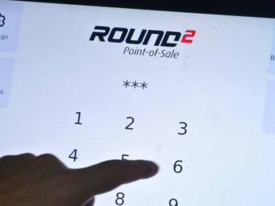 Liquor control POS touchscreen showing Round 2 POS interface.