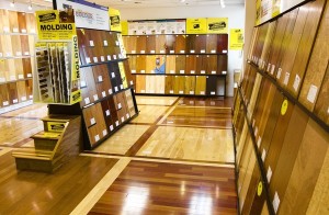 Various hardwood floors and moldings are displayed at a Lumber Liquidators showroom