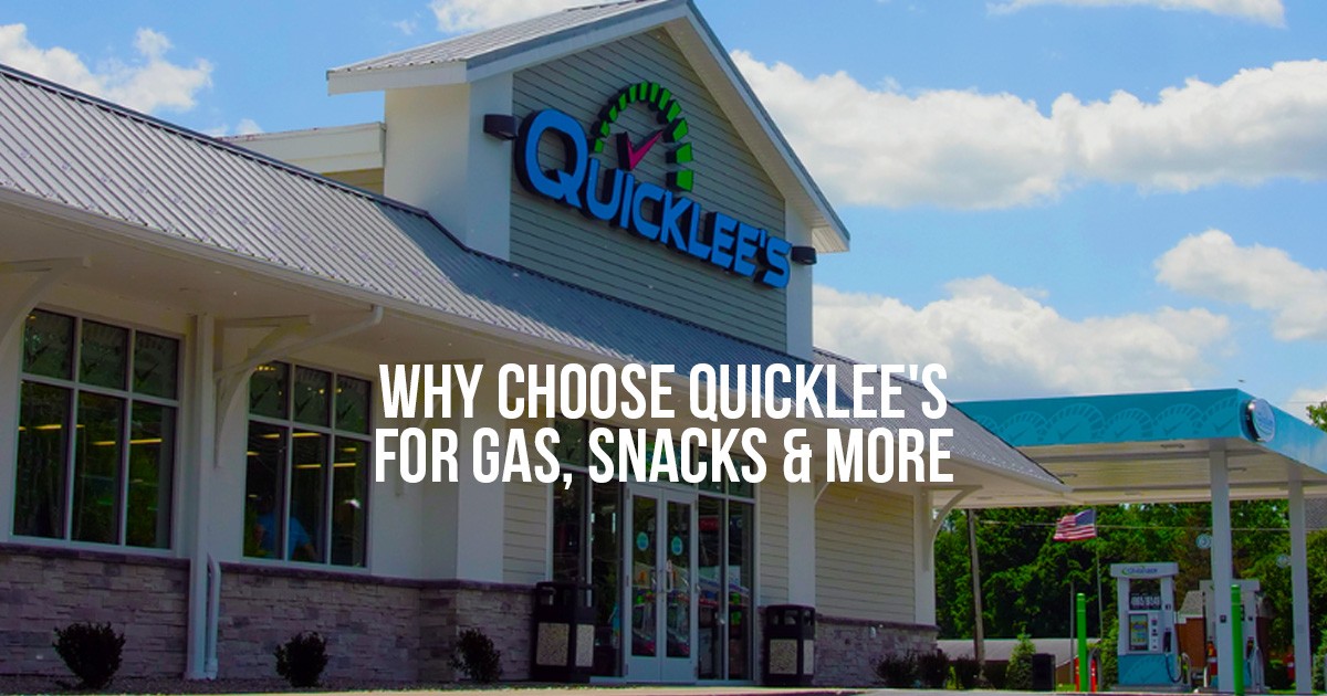 A Quicklee’s convenience store and gas station with bright signage under a blue sky.
